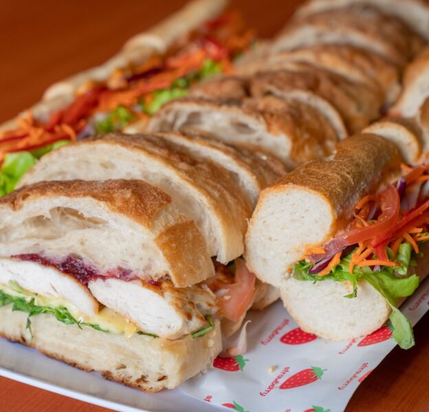 Sliced chicken sandwich on a platter